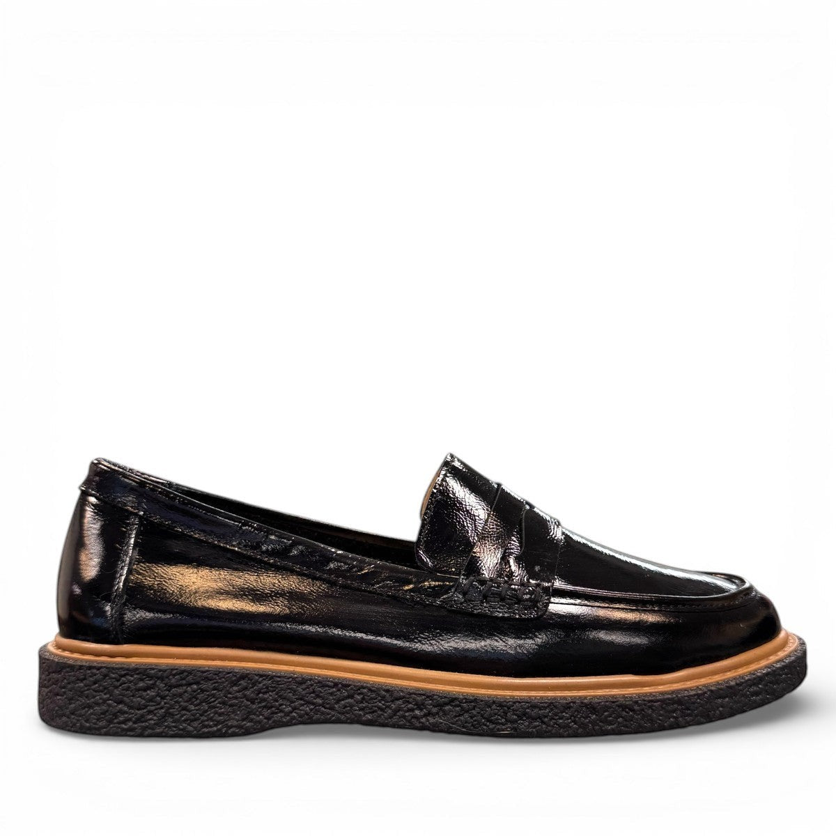 ROAMERS NILA black metallic leather loafer with a platform sole and saddle strap detail.
photo of the right side