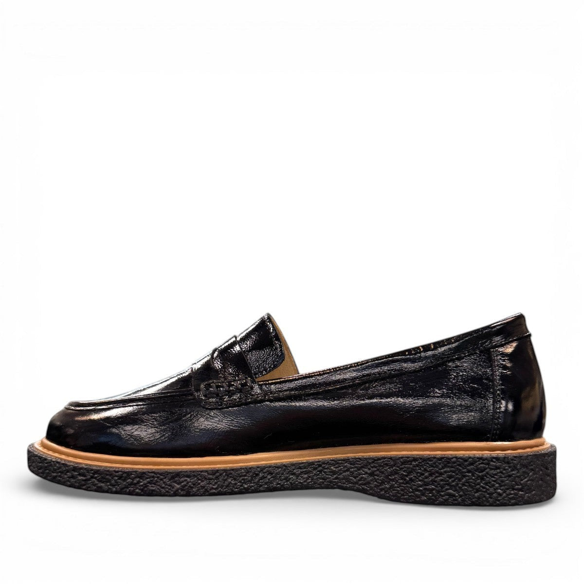 ROAMERS NILA black metallic leather loafer with a platform sole and saddle strap detail.
photo of the left side