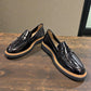 ROAMERS NILA black metallic leather loafer with a platform sole and saddle strap detail.
photo of the front side