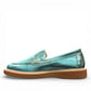 Roamers Nila metallic teal leather loafer with a brown platform sole and moccasin-style stitching.
photo of the left side