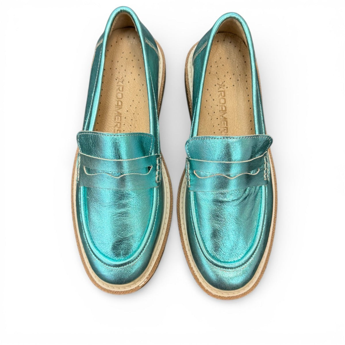 Roamers Nila metallic teal leather loafer with a brown platform sole and moccasin-style stitching.
photo of the top side