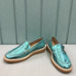 Roamers Nila metallic teal leather loafer with a brown platform sole and moccasin-style stitching.
photo of the front side