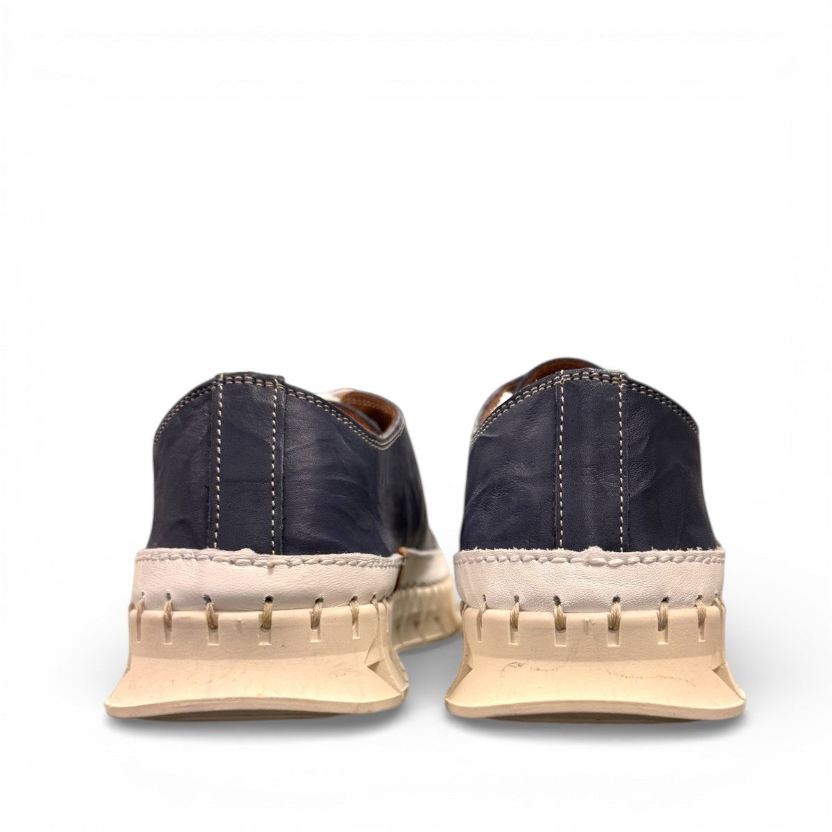 ROAMERS PARIS leather sneakers in navy and white with a unique chunky rubber sawtooth outsole.
photo of the back side