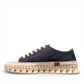 ROAMERS PARIS leather sneakers in navy and white with a unique chunky rubber sawtooth outsole.
photo of the left side
