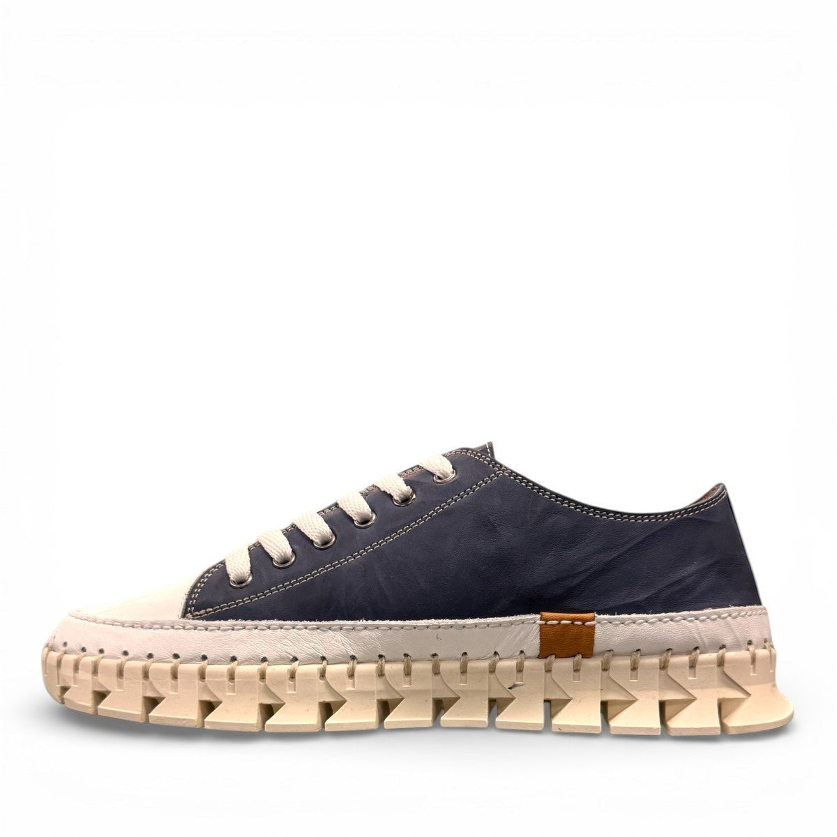 ROAMERS PARIS leather sneakers in navy and white with a unique chunky rubber sawtooth outsole.
photo of the left side