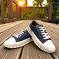 ROAMERS PARIS leather sneakers in navy and white with a unique chunky rubber sawtooth outsole.
photo of the front side
