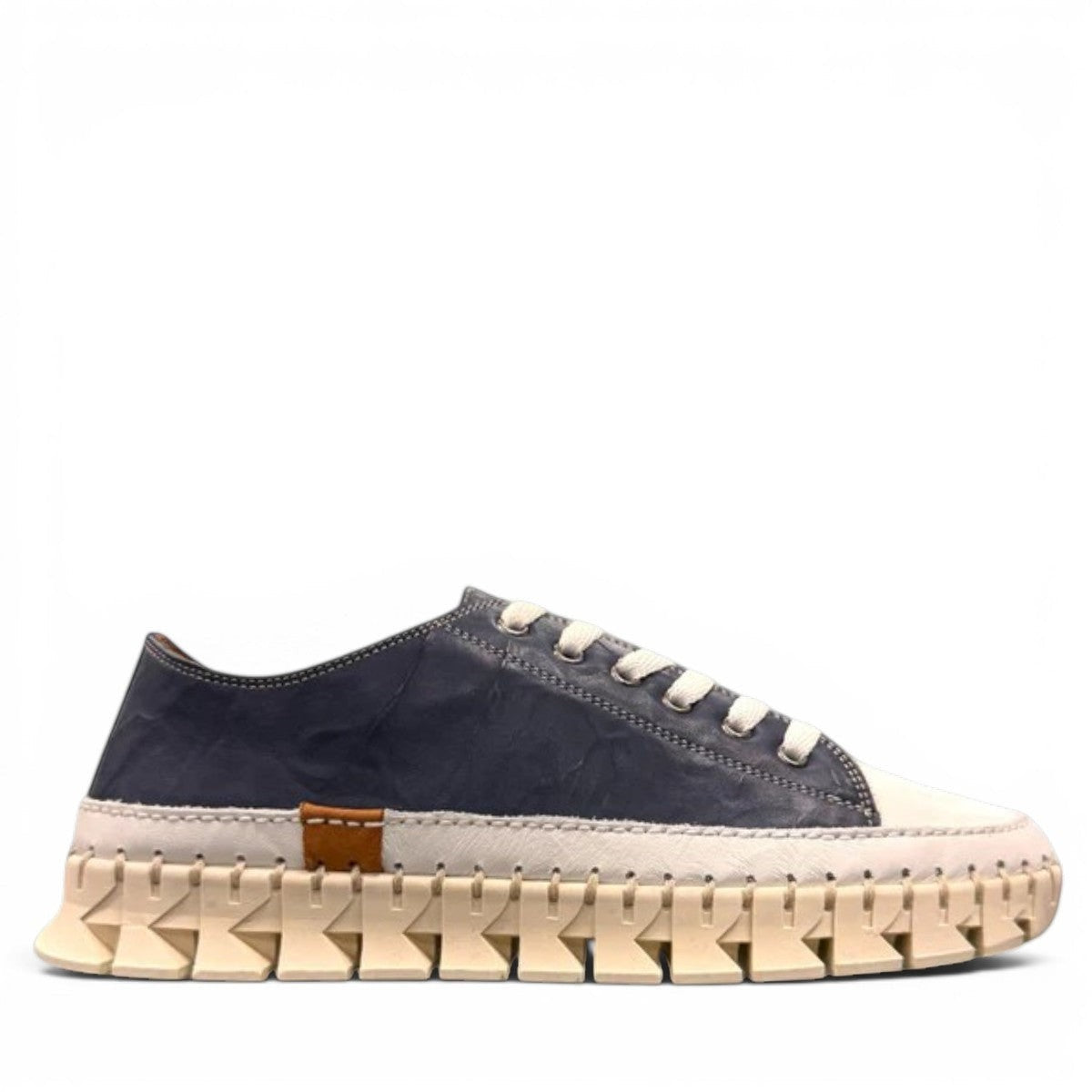 ROAMERS PARIS leather sneakers in navy and white with a unique chunky rubber sawtooth outsole.
photo of the  right side