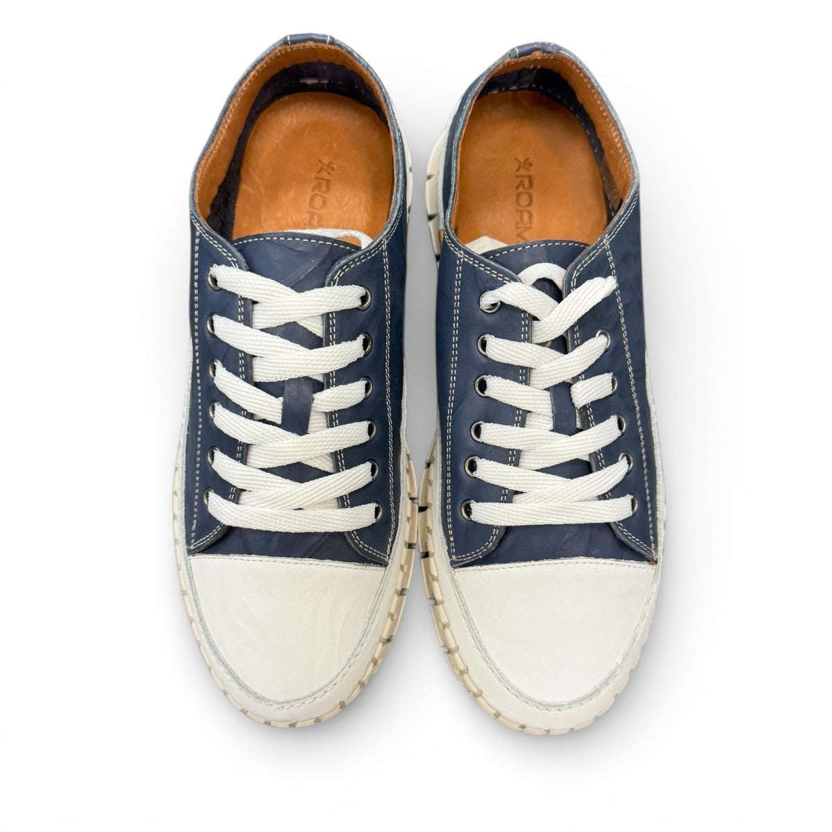 ROAMERS PARIS leather sneakers in navy and white with a unique chunky rubber sawtooth outsole.
photo of the top side