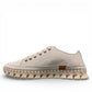 Roamers Paris white leather sneaker with a unique textured rubber outsole and lace-up design.
photo of the left side