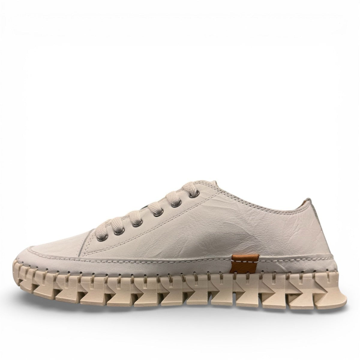 Roamers Paris white leather sneaker with a unique textured rubber outsole and lace-up design.
photo of the left side