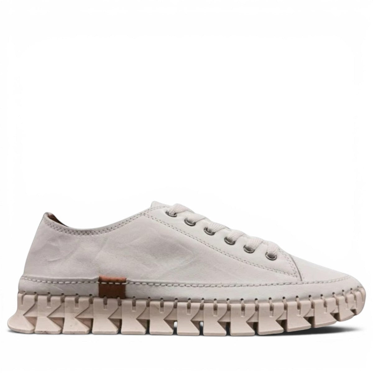 Roamers Paris white leather sneaker with a unique textured rubber outsole and lace-up design.
photo of the right side