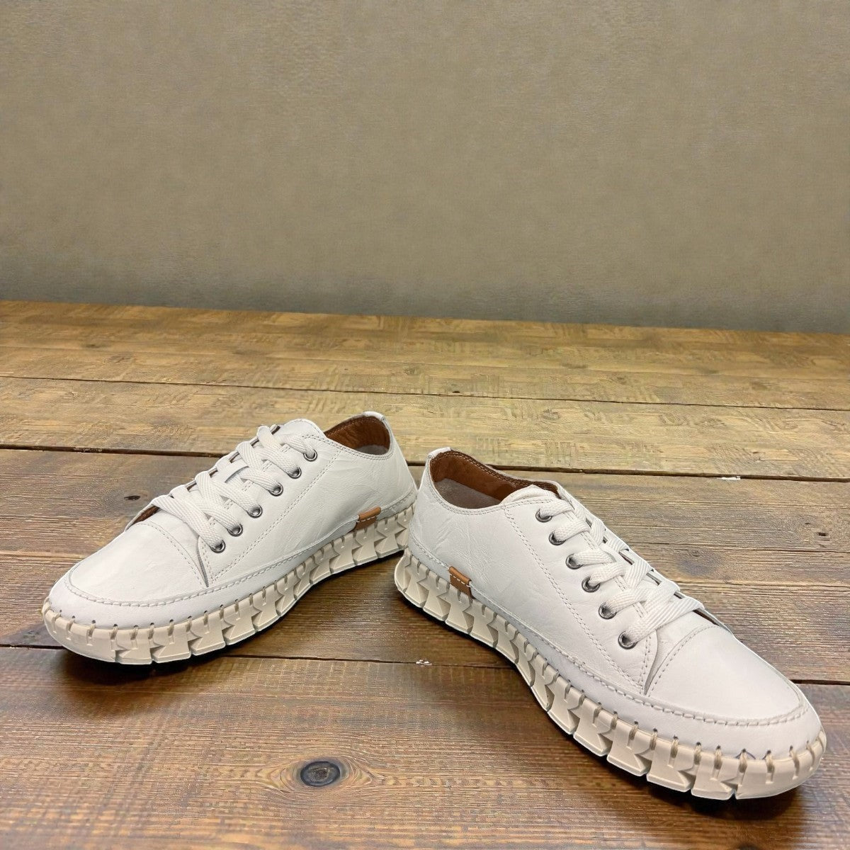Roamers Paris white leather sneaker with a unique textured rubber outsole and lace-up design.
photo of the front side