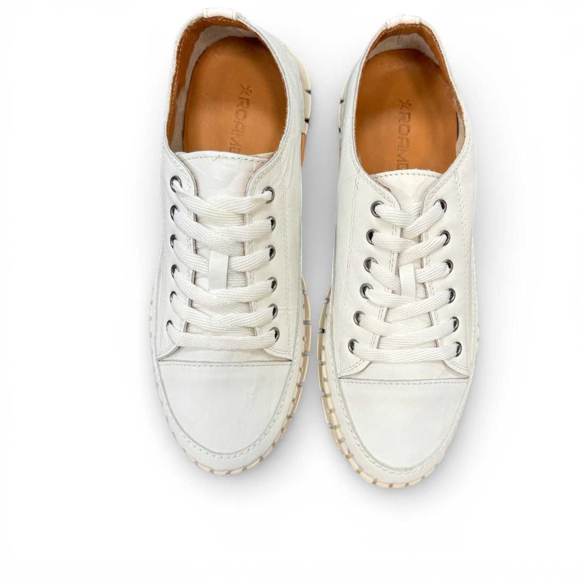 Roamers Paris white leather sneaker with a unique textured rubber outsole and lace-up design.
photo of the top side