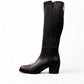 Roamers Peace black leather knee-high boot with block heel and decorative side zipper.
photo of the left side