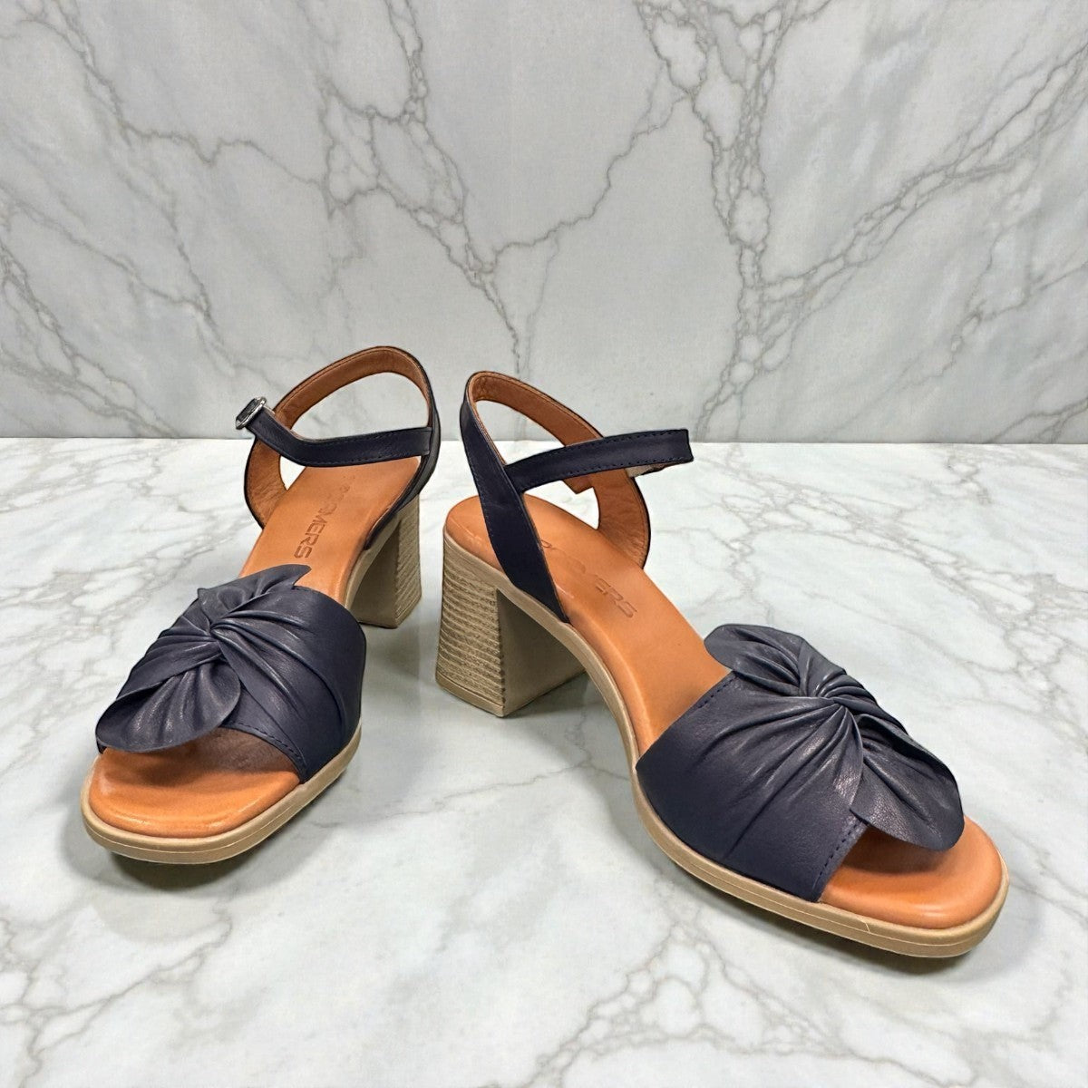 Roamers Quana navy leather heeled sandals with an adjustable instep strap and 2.5-inch block heel.
photo of the front side