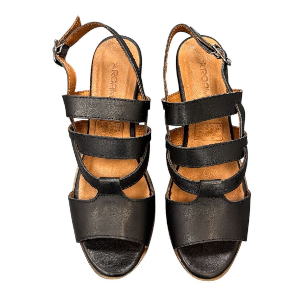 roamers Remi black leather heeled sandals with an adjustable back strap and comfortable rubber outsole.
photo of the top side