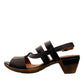 roamers Remi black leather heeled sandals with an adjustable back strap and comfortable rubber outsole.
photo of the left side