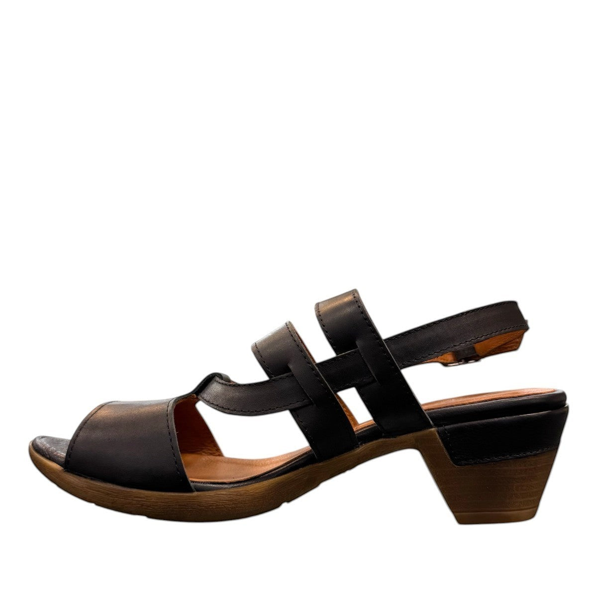roamers Remi black leather heeled sandals with an adjustable back strap and comfortable rubber outsole.
photo of the left side