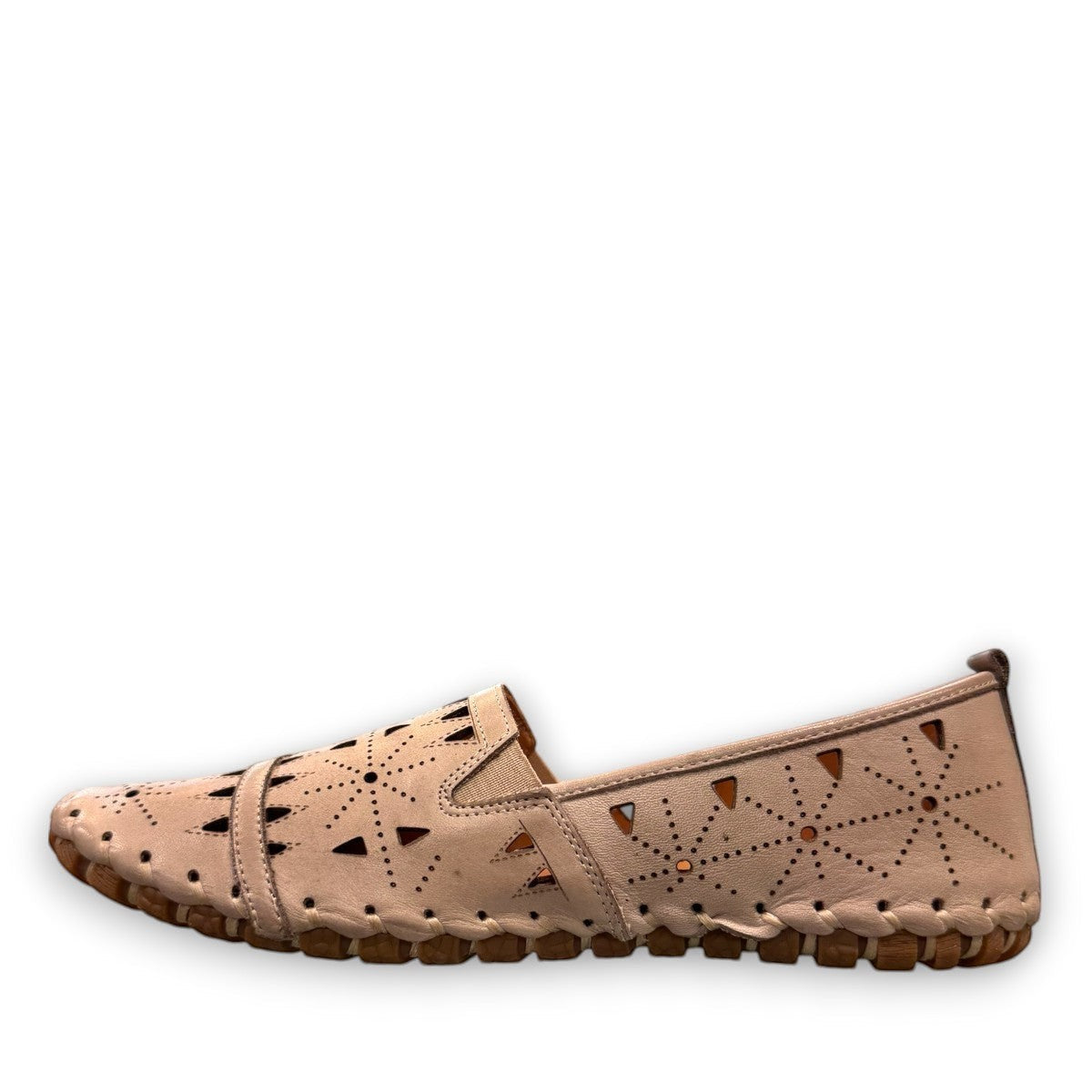 roamers silver gray leather slip-on loafer with geometric laser cutouts and artisan stitched detailing.
photo of the left side