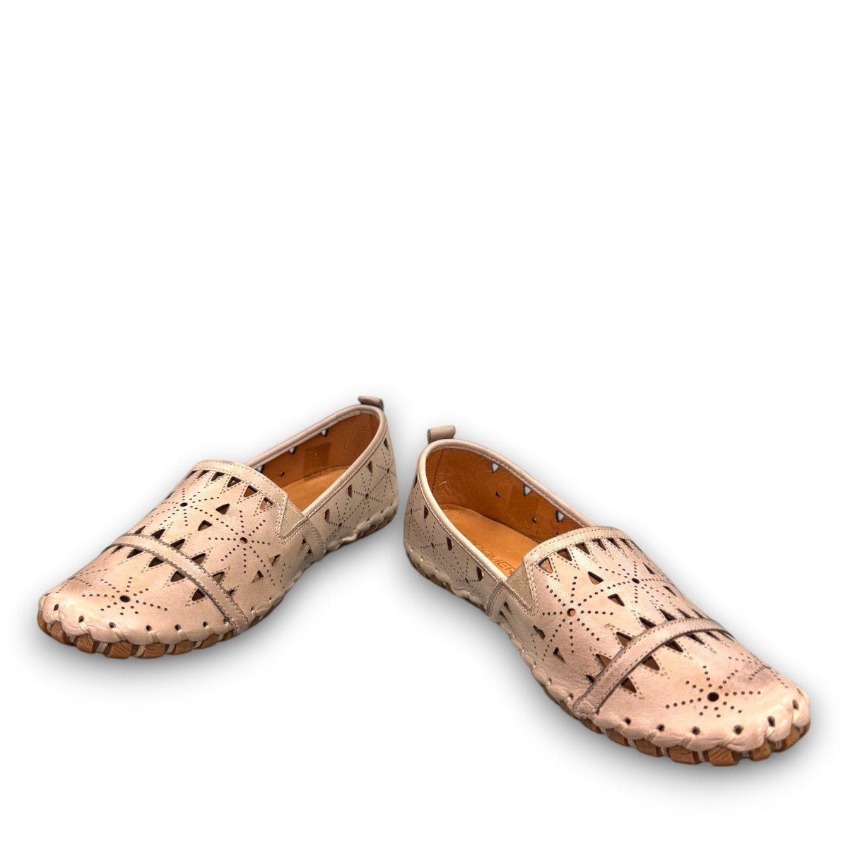 roamers silver gray leather slip-on loafer with geometric laser cutouts and artisan stitched detailing.
photo of the front side