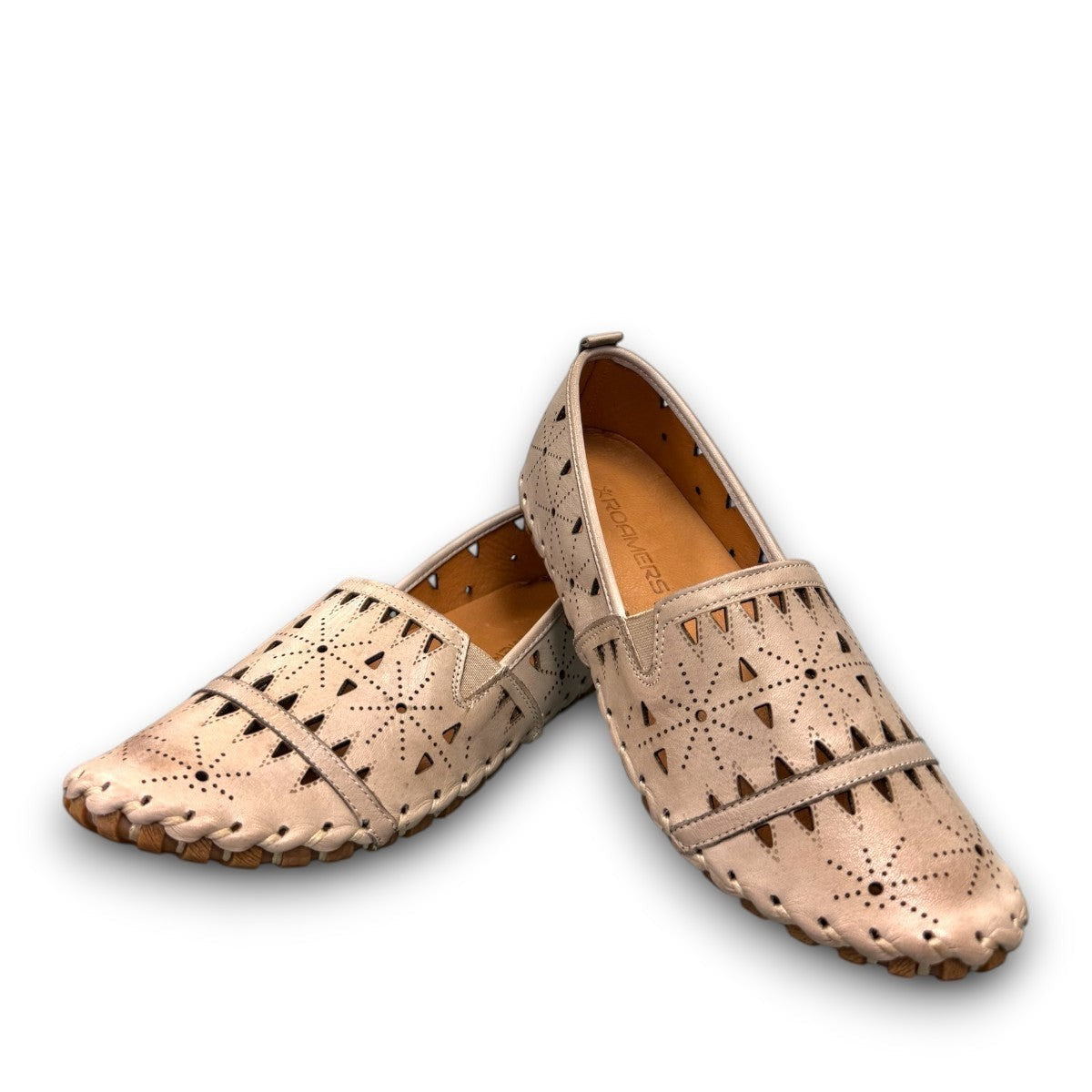 roamers silver gray leather slip-on loafer with geometric laser cutouts and artisan stitched detailing.
photo of the front side