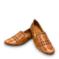 roamers tan leather slip-on loafer with geometric laser cutouts, artisan stitching, and flexible rubber outsole.
photo of the front side