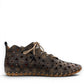 Roamers Venus black leather ankle boots with decorative floral cutouts, elastic lacing, and flat sole.
photo of the right side