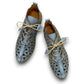 ROAMERS VENUS ankle shoes in Anar grey leather with floral cutouts, elastic lacing, and flexible sole.
photo of the top