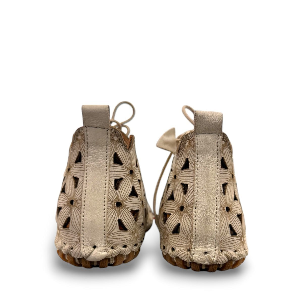 Roamers Venus mink leather ankle boots featuring a decorative floral cutout pattern and elastic lacing.
photo of the back side