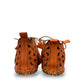 Roamers Venus ankle shoes in sun burn orange leather with decorative floral cutouts and elastic lacing.
photo of the back