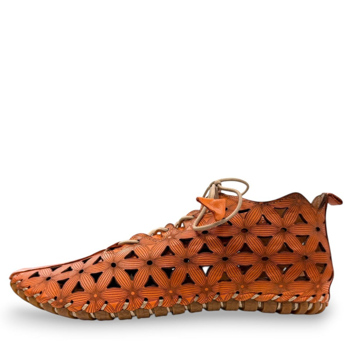Roamers Venus ankle shoes in sun burn orange leather with decorative floral cutouts and elastic lacing.
photo of the left