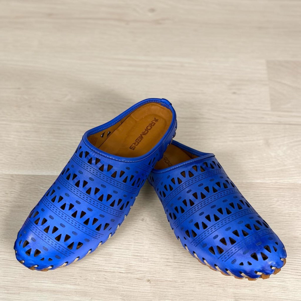 Roamers Verity sax blue leather slip-on sandal with breathable perforated cutouts and a rubber outsole.
photo of the front side