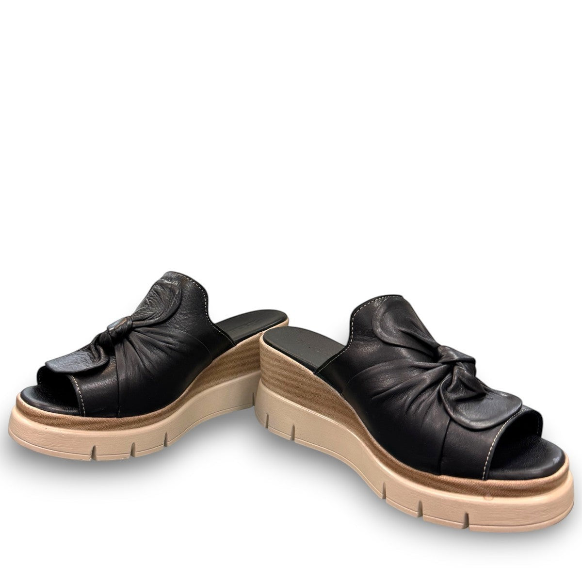 Roamers Veronica black leather slip-on wedge sandal with a knotted detail and platform sole.
photo of the front side