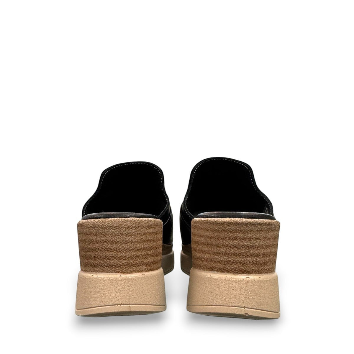 Roamers Veronica black leather slip-on wedge sandal with a knotted detail and platform sole.
photo of the back side