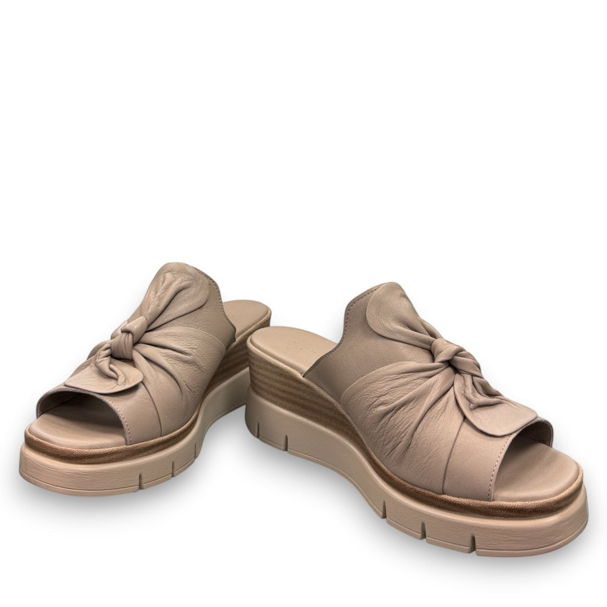Roamers Veronica silver grey leather wedge mules with a knotted front detail and platform sole.
photo of the front side