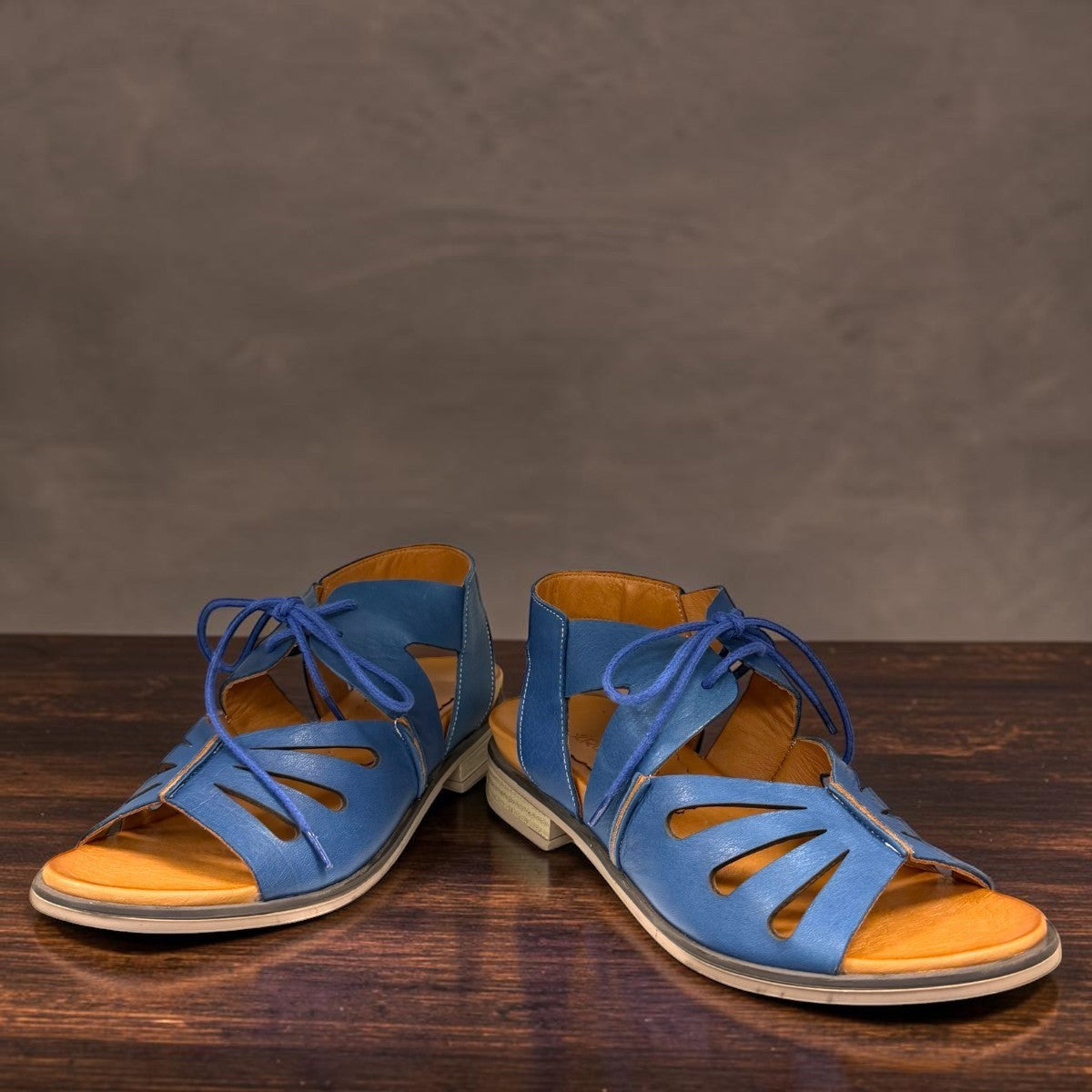 Roamers Vienna sax blue leather lace-up sandals with open-toe design and low block heel.
photo of the front