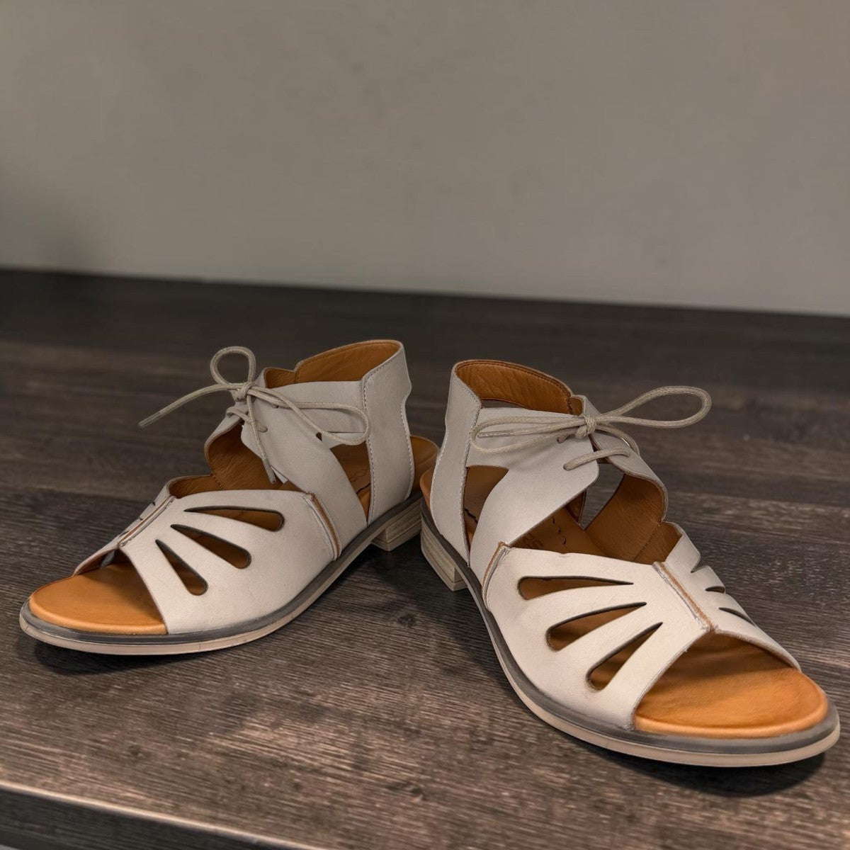 Roamers Vienna silver grey leather sandals with lace-up closure and cut-out floral toe detail.
photo of the front side