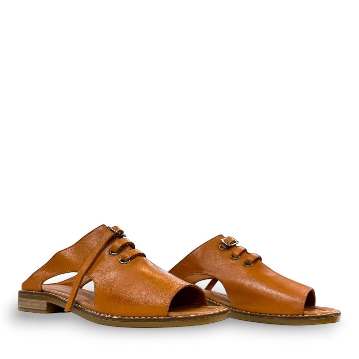 Roamers Whitney backless leather sandals in coconut brown with slip-on design and lace-up detail.
photo of the front side