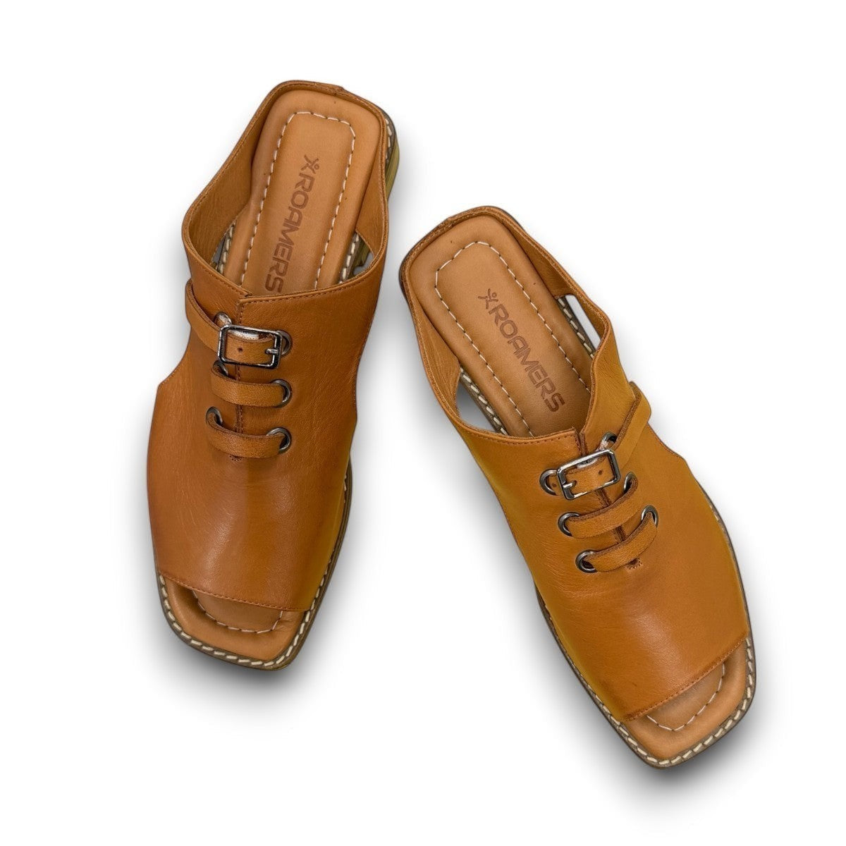Roamers Whitney backless leather sandals in coconut brown with slip-on design and lace-up detail.
photo of the top side