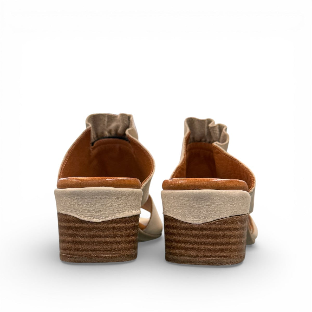 Roamers Zola slides in egret cream leather with a low block heel and gathered front detail.
photo of the back side