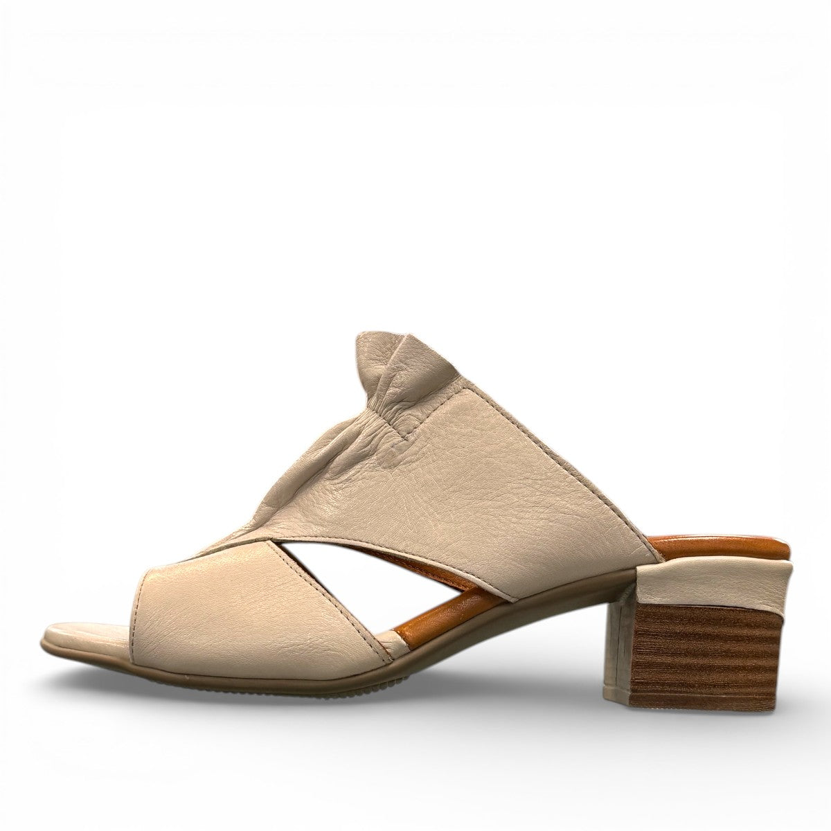 Roamers Zola slides in egret cream leather with a low block heel and gathered front detail.
photo of the left side