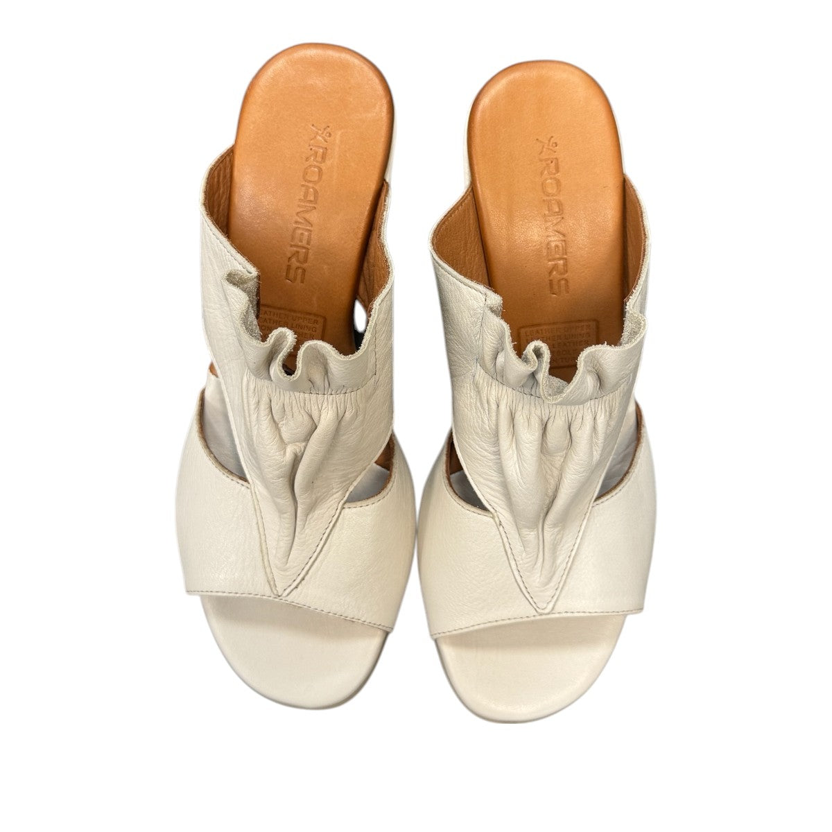 Roamers Zola slides in egret cream leather with a low block heel and gathered front detail.
photo of the top side
