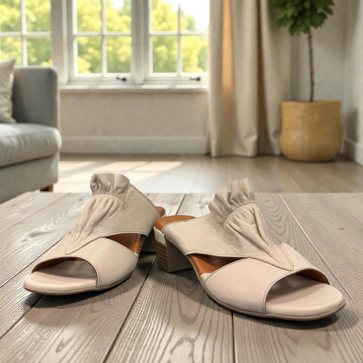 Roamers Zola slides in egret cream leather with a low block heel and gathered front detail.
photo of the front side