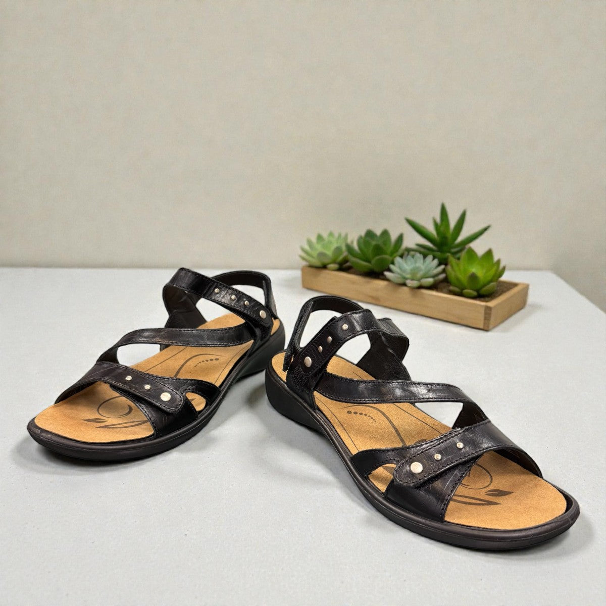 Romika Ibiza 70 black leather sandals with three adjustable hook and loop straps and flexible outsole.
photo of the front side