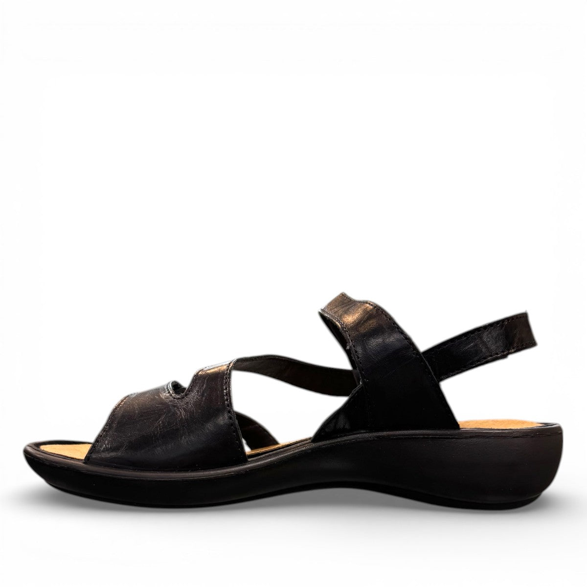 Romika Ibiza 70 black leather sandals with three adjustable hook and loop straps and flexible outsole.
photo of the left side