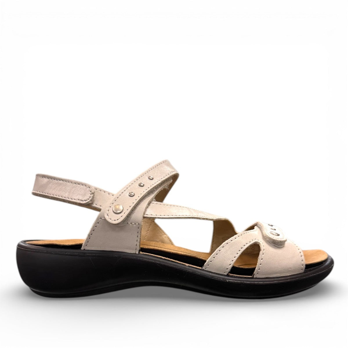 Romika Ibiza 70 white leather sandal with three adjustable hook and loop straps and dark outsole.
photo of the right side