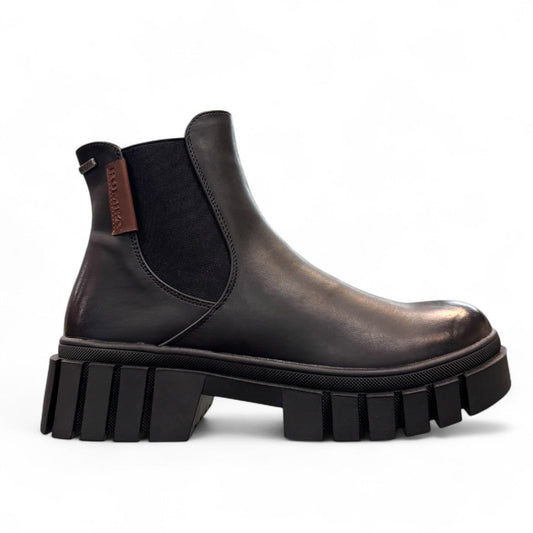 Romika Ruby 01 black vegan leather Chelsea boot with a chunky platform lug sole and elastic side panels.
photo of the right side
