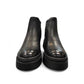 Romika Ruby 01 black vegan leather Chelsea boot with a chunky platform lug sole and elastic side panels.
photo of the front side