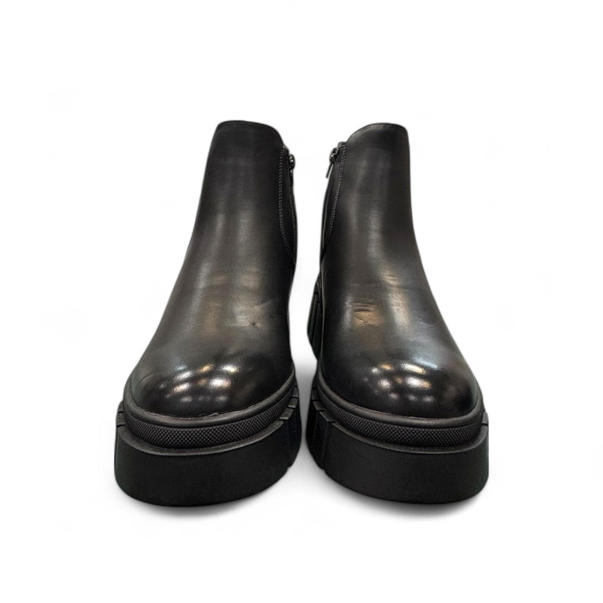 Romika Ruby 01 black vegan leather Chelsea boot with a chunky platform lug sole and elastic side panels.
photo of the front side