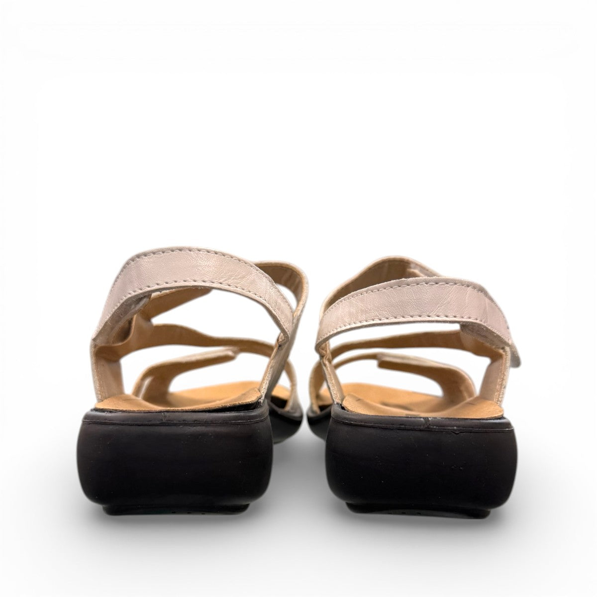 Romika Ibiza 70 white leather sandal with three adjustable hook and loop straps and dark outsole.
photo of the back side